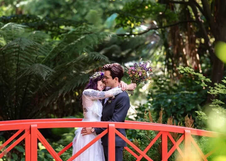 wedding couple on the red bridge at Abbotsbury