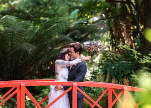 wedding couple on the red bridge at Abbotsbury wedding couple on the red bridge at Abbotsbury